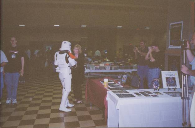 Aren't you a little short for a Stormtrooper?  One of Vader's minions attempts to score with the Tron chick.
